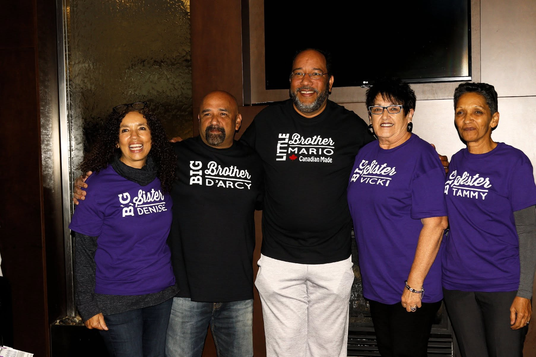 Mario Wells with his biological brother and sisters in 2019.