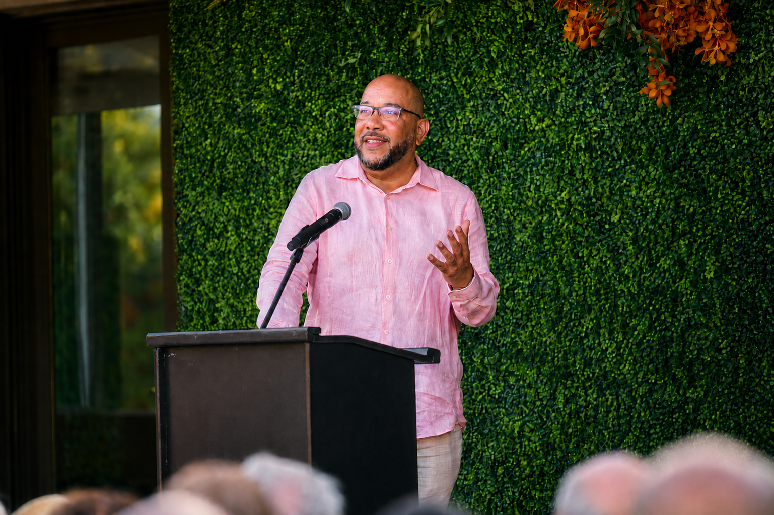 Mario Wells speaking on stage